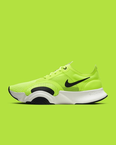 Green and black Nike sneakers
